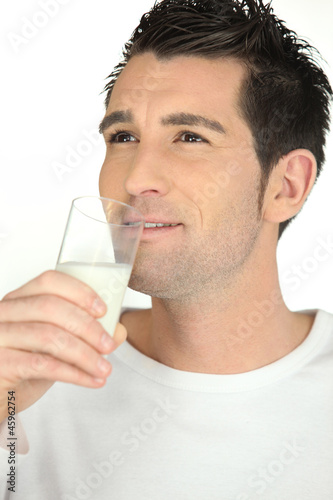 Man drinking glass of milk