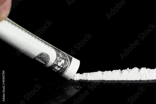 Person taking a line of illegal white substance