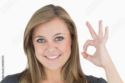 Woman making hand sign