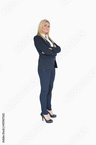 Happy business woman crossing her arms