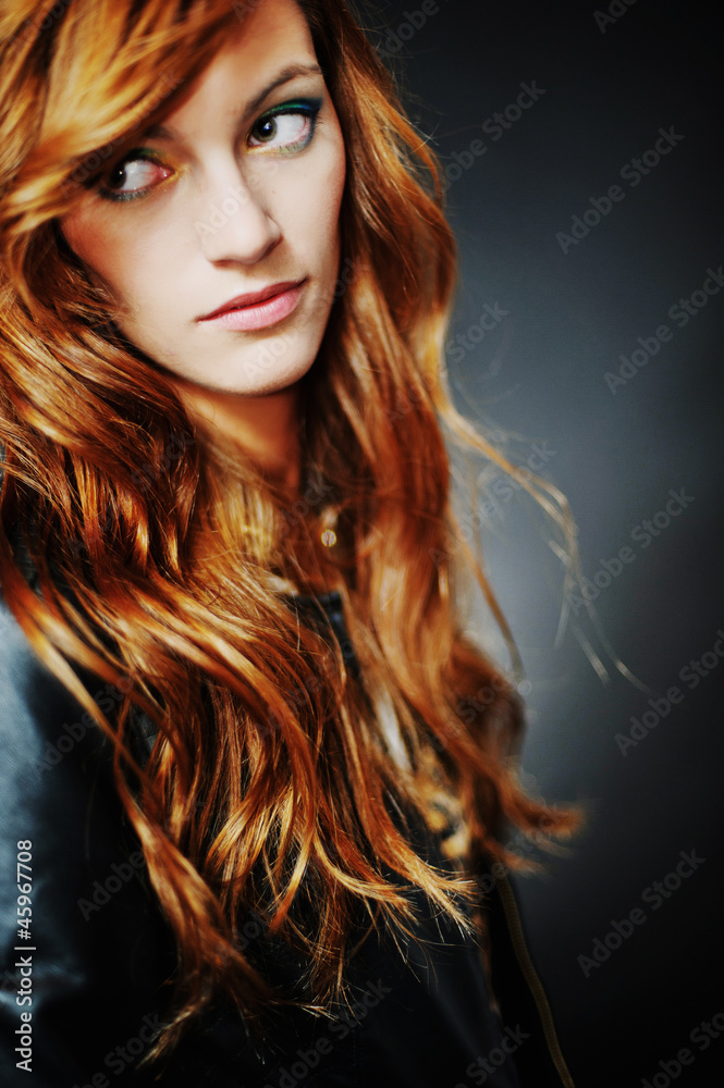 Fototapeta premium Portrait of woman model with shiny long hair