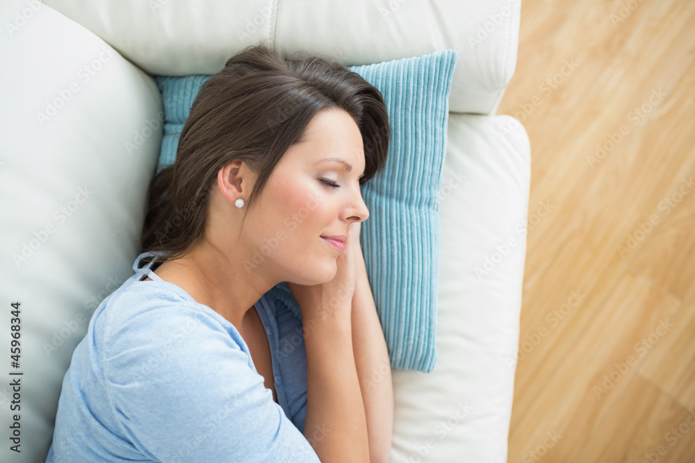 Calm woman lying and sleeping on sofa Calm woman lying and sleeping on sofa