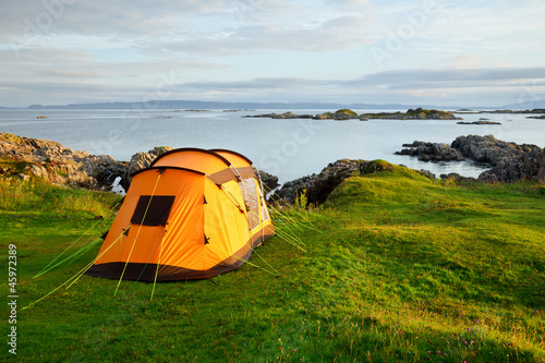 Camping tent on ocean shore