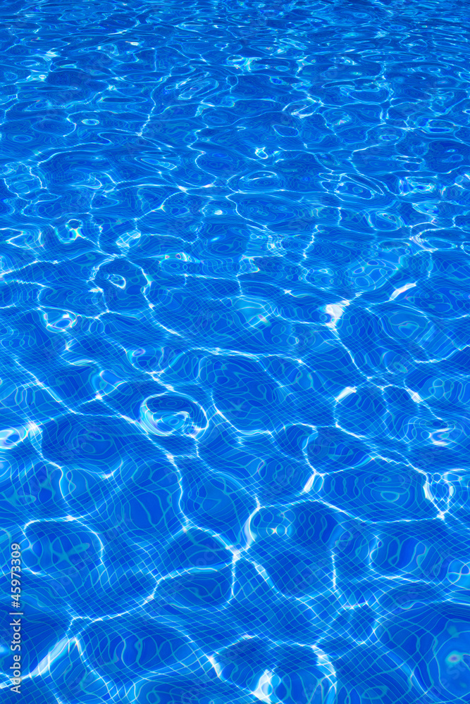 Blue tiels pool with ripple water reflection