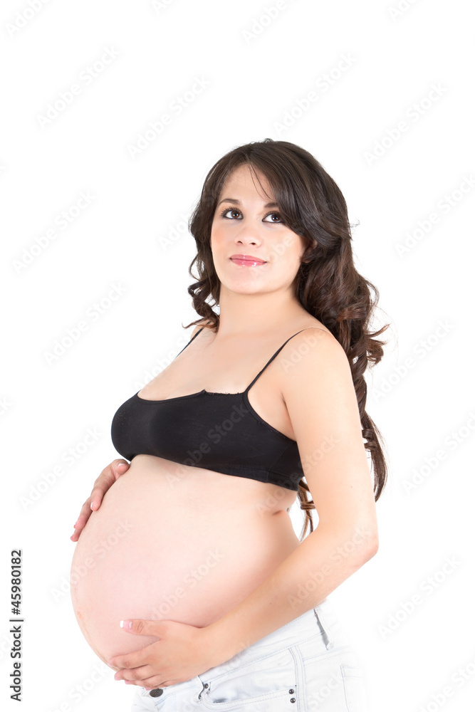 Young beautiful pregnant woman with long dark hair standing Young beautiful pregnant woman with long dark hair standing