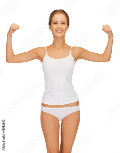 woman in cotton undrewear flexing her biceps © Syda Productions