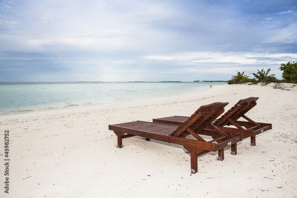 two sunbeds at the beach