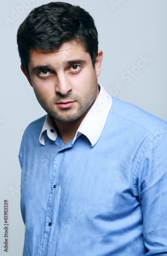 Closeup portrait of handsome business man manager looking seriou