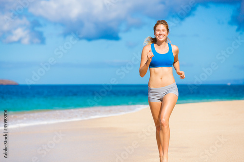 Beautiful Athletic Woman Running on the Beach