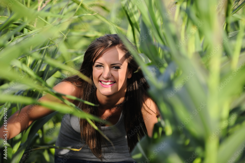smiling woman in cornfield smiling woman in cornfield
