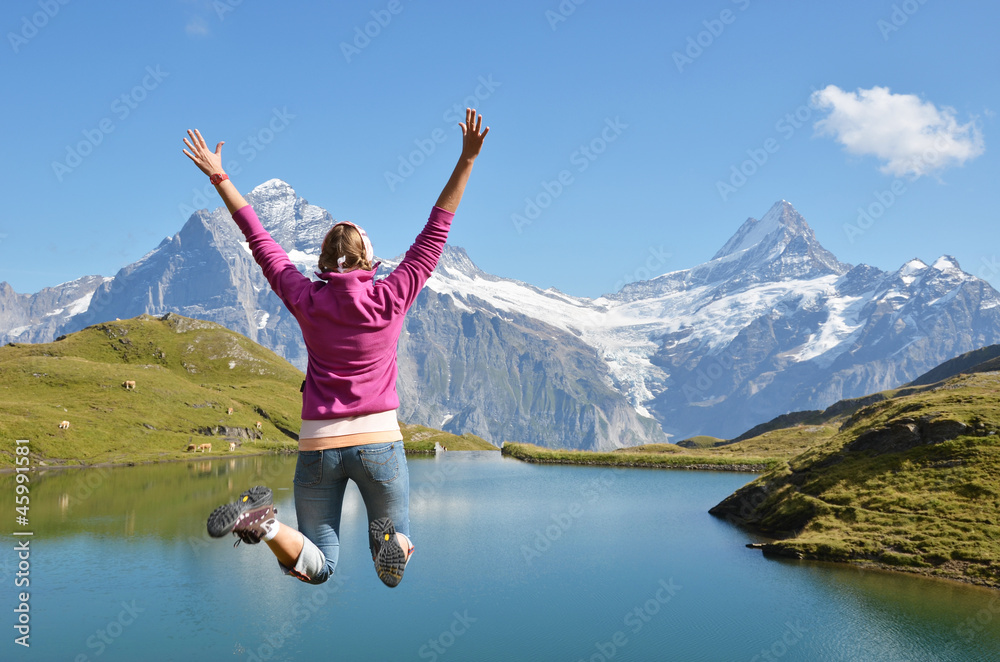 Girl against Alpine scenery. Jungfrau region, Switzerland Girl against Alpine scenery. Jungfrau region, Switzerland