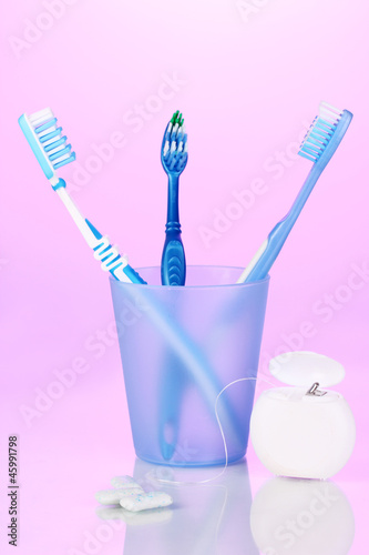 Toothbrush in glass  dental floss and chewing gum
