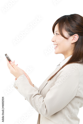 Beautiful young businesswoman using a cellular phone. Portrait o