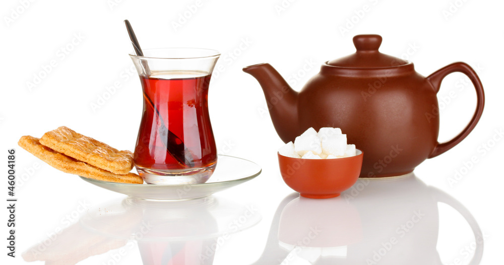 glass of Turkish tea and kettle isolated on white glass of Turkish tea and kettle isolated on white