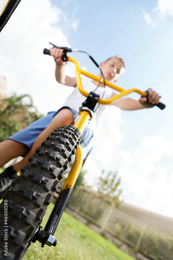 boy  on a bike outside