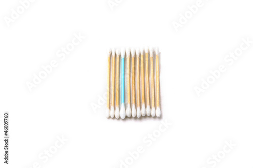 Blue stick in the row of yellow wooden cotton sticks