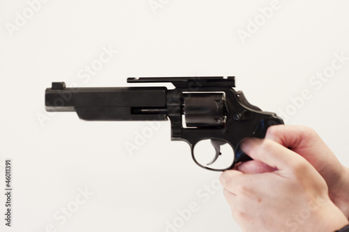 gun in hand against white background