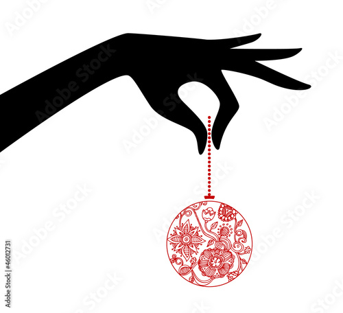 Woman hand holding xmas ball