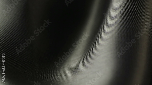 background of black satin fabric closeup