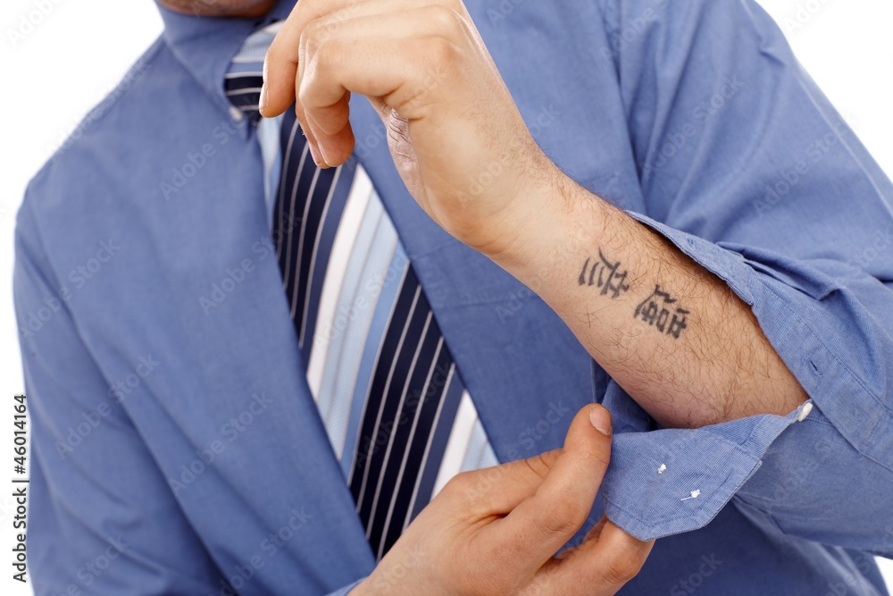 Body part of businessman with tattoo in forearm Stock Photo | Adobe Stock