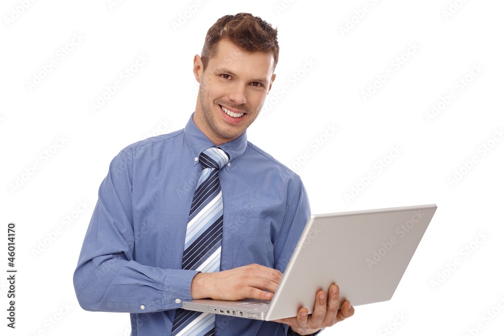 Happy businessman holding laptop Happy businessman holding laptop