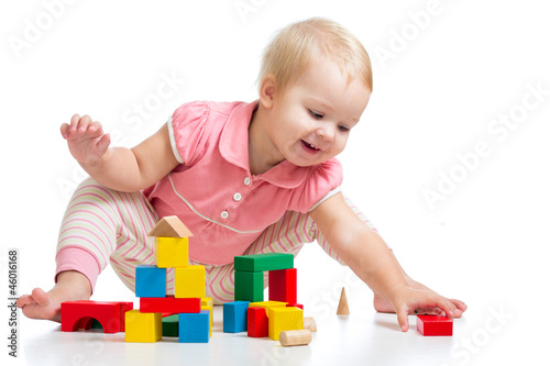 Happy kid playing toy block...