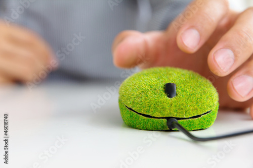 hand holding green computer mouse