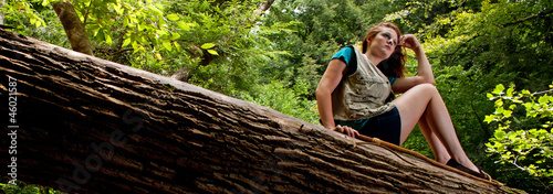 Adventuress on a log