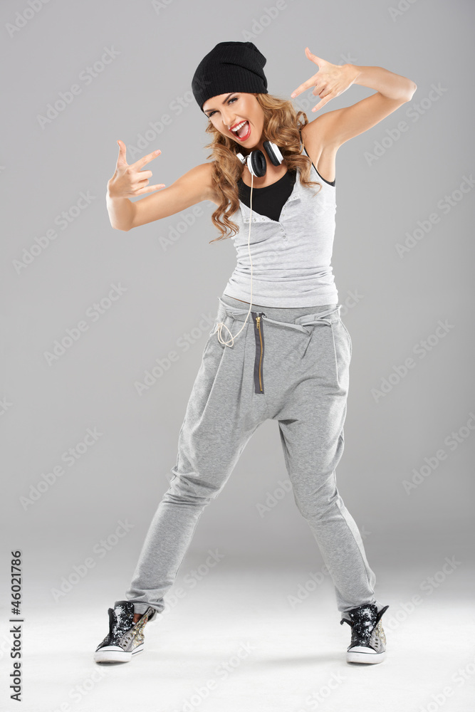 Female modern dancer posing on grey Female modern dancer posing on grey