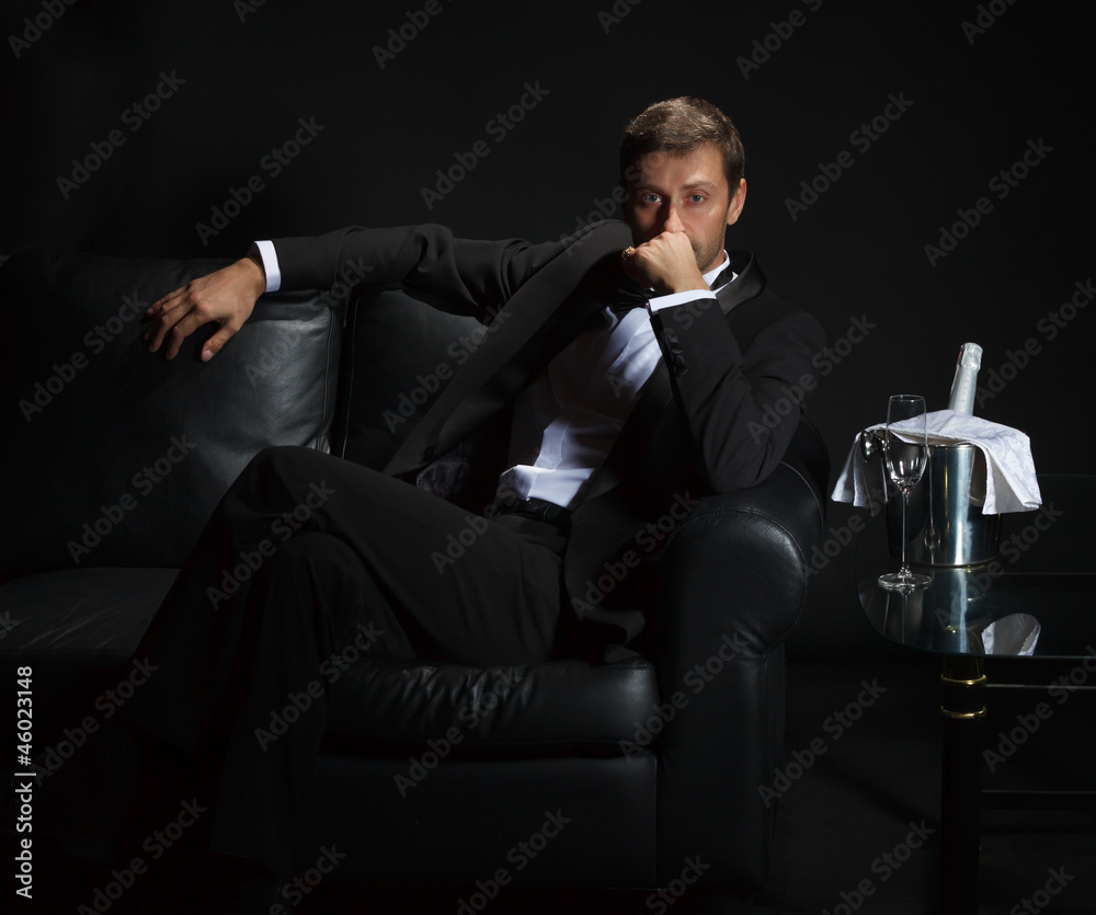 Sexy man in tuxedo waiting for his date Sexy man in tuxedo waiting for his date