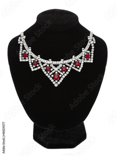 Pendant with red gem stones on black mannequin isolated on white