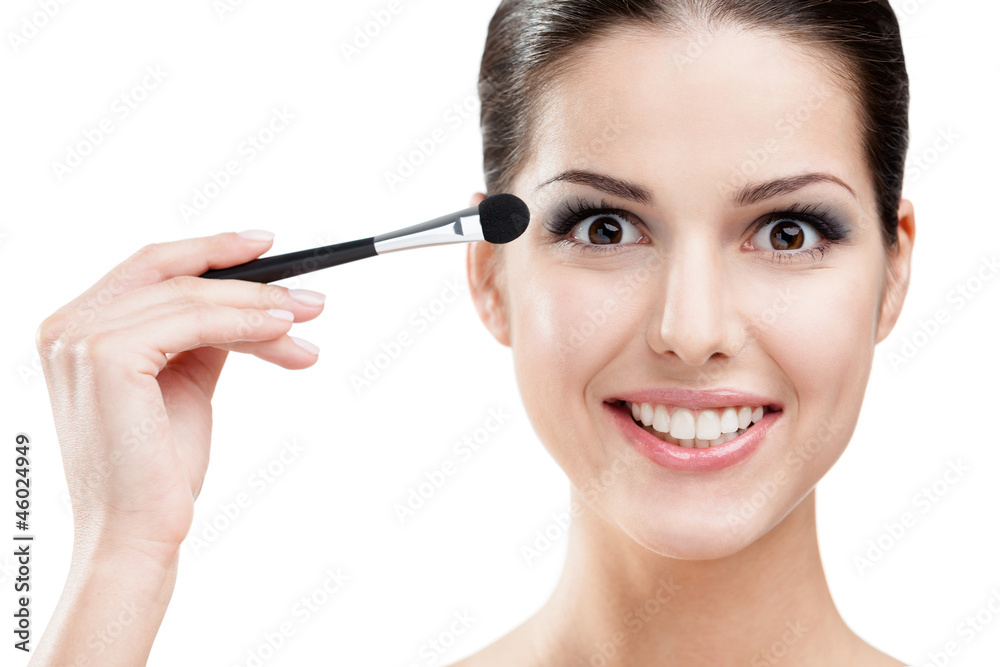 Woman applying make up with brush