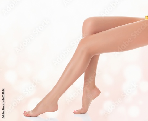 Legs of a woman against abstract pastel background © Nobilior