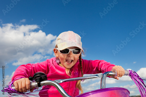 little girl on bicycle