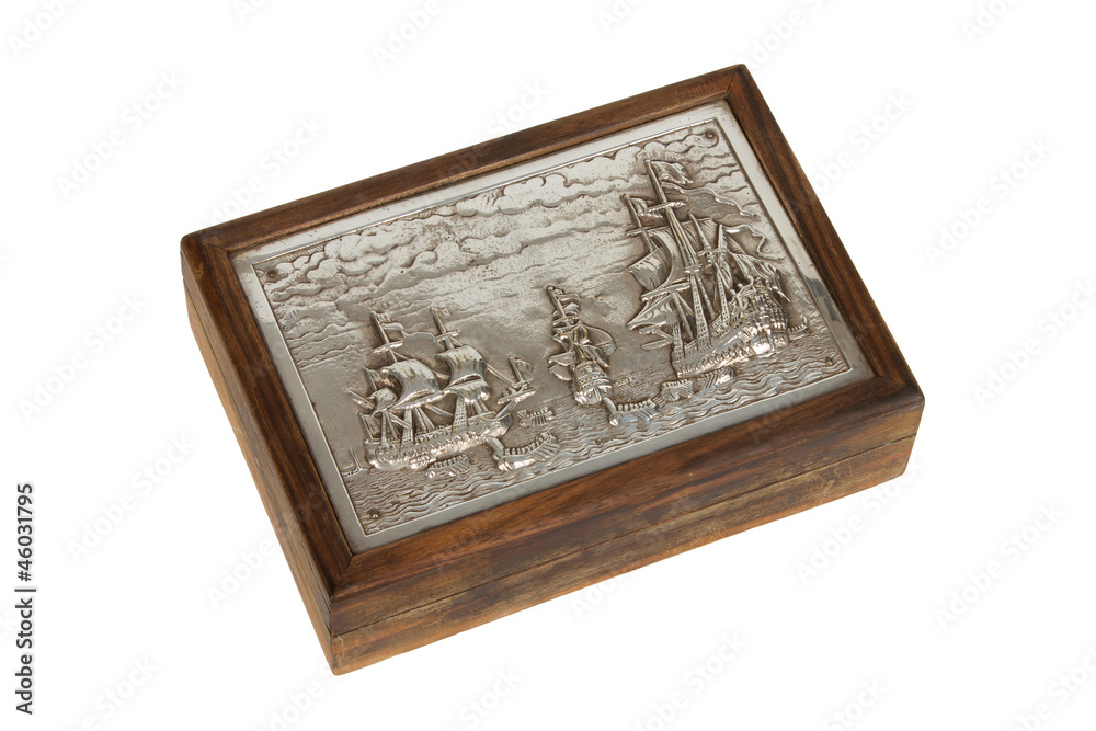 Silver engraving on a old wooden box, isolated Silver engraving on a old wooden box, isolated