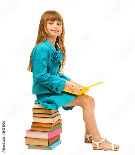 little girl with a books is...