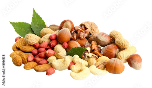 assortment of tasty nuts with leaves, isolated on white