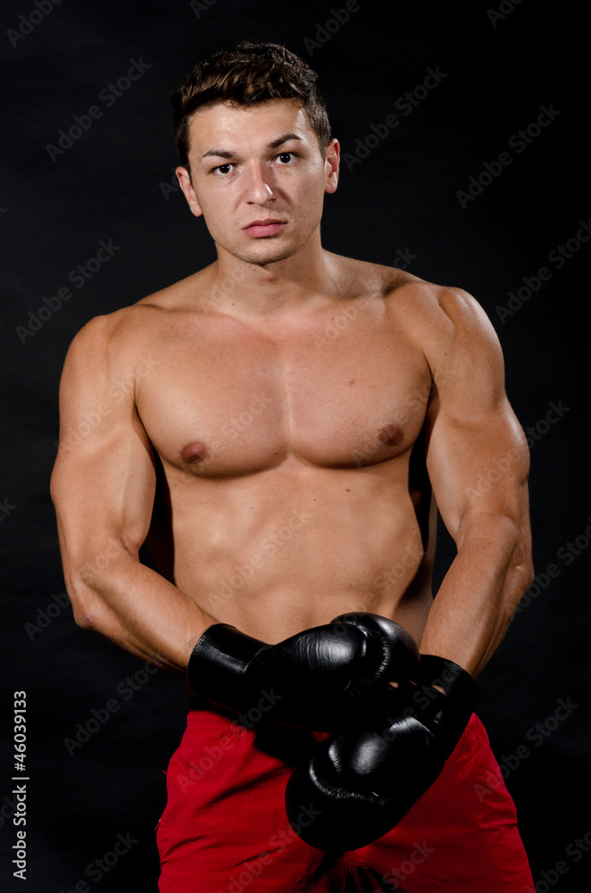 Muscular young man ready for box