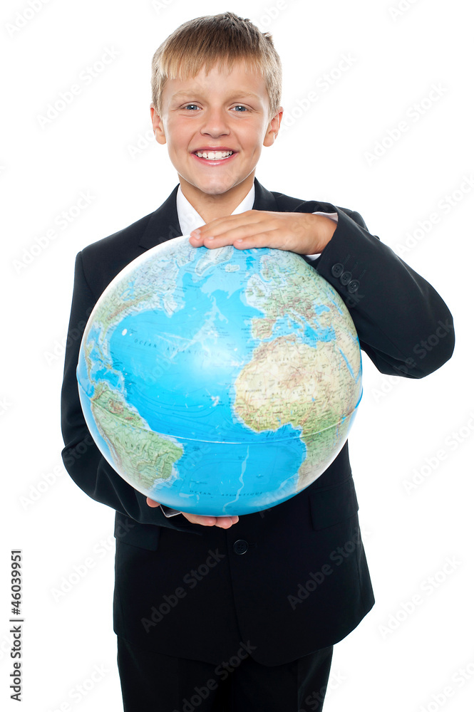 Cheerful boy in suit holding globe with both hands Cheerful boy in suit holding globe with both hands