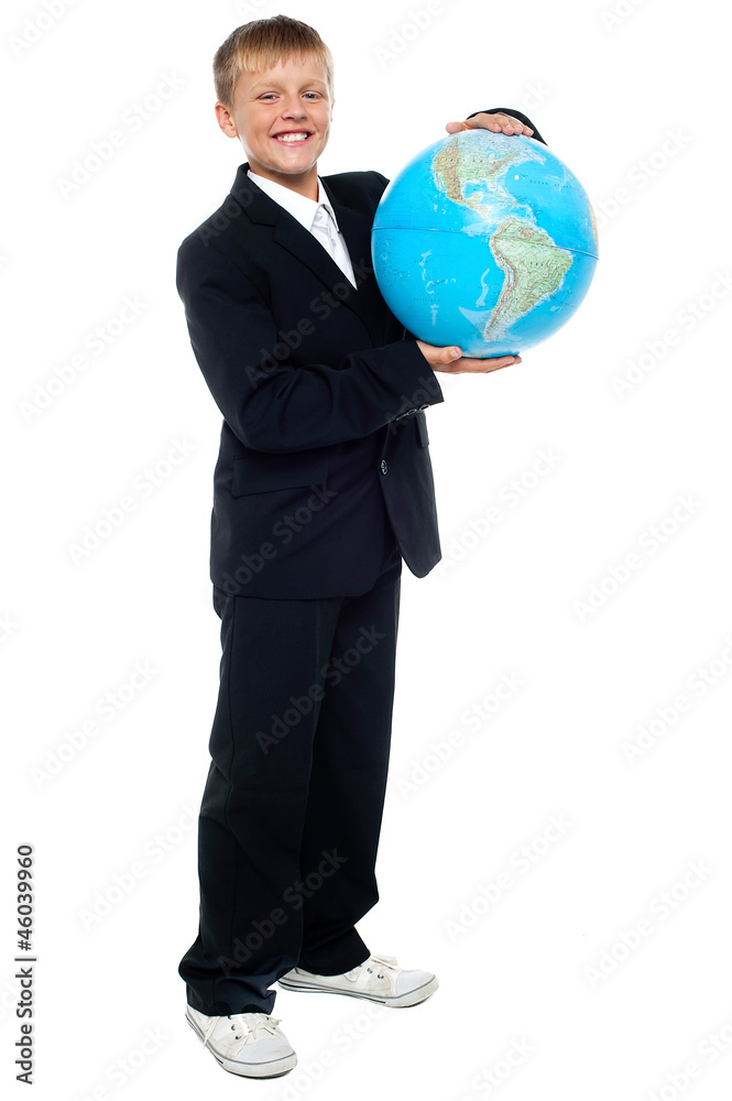 Smart looking young kid holding globe Smart looking young kid holding globe