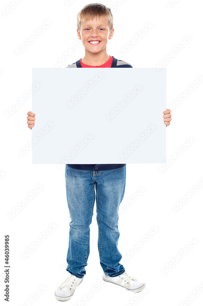 Full length portrait of boy holding blank whiteboard Full length portrait of boy holding blank whiteboard