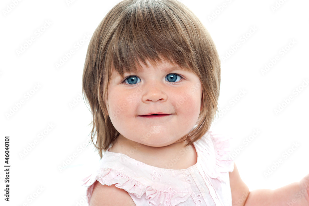 Closeup shot of a chubby female kid with blue eyes Closeup shot of a chubby female kid with blue eyes