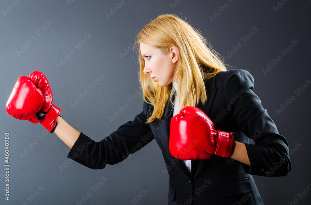 Woman boxer in dark room Woman boxer in dark room