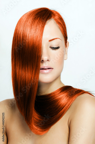 red hair   beautiful young red-headed woman with long shiny hair