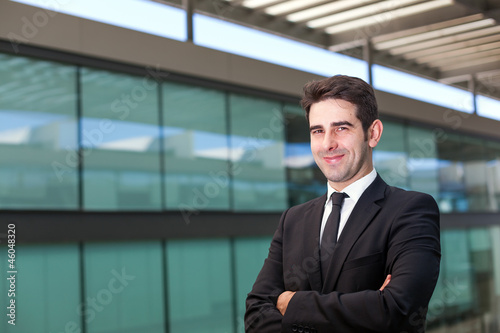 Wallpaper Mural Portrait of a handsome young business man at modern office Torontodigital.ca
