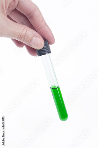 Colored liquid in test tube in hand
