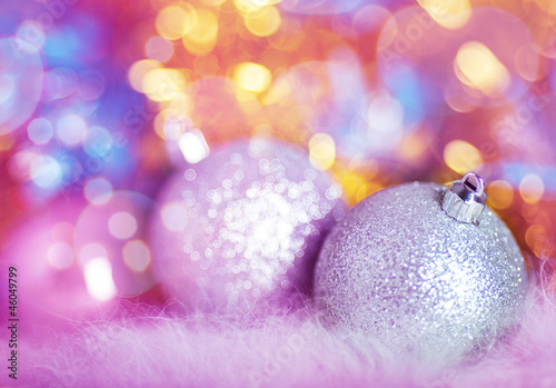 Greeting card with silver Christmas balls on colorful background