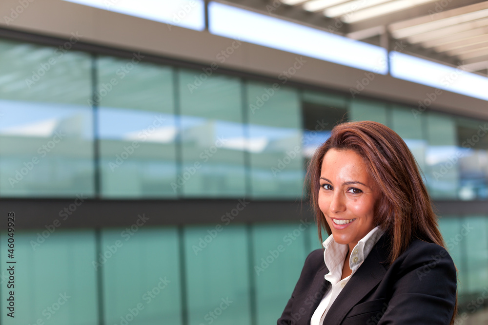 Smiling young business woman at the office