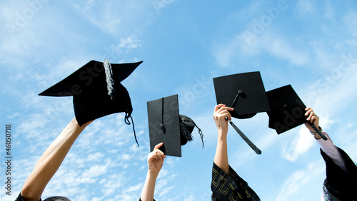 throwing graduation hats photo