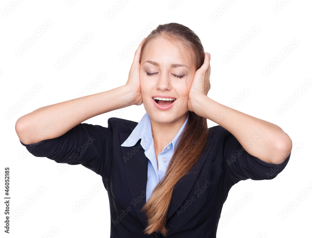 Cheerful young woman with eyes closed covering ears isolated Cheerful young woman with eyes closed covering ears isolated